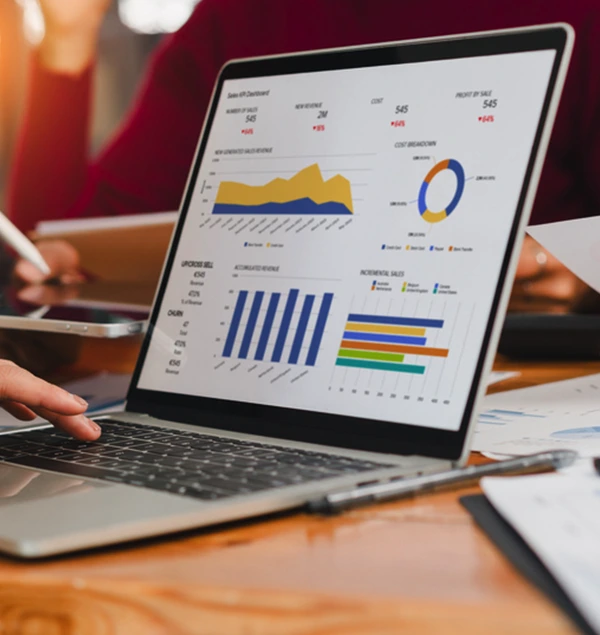 Marketing performance charts on a laptop