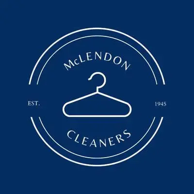 A white hanger icon in a circular logo with the text "McLENDON CLEANERS" and "EST. 1945" on a dark blue background.