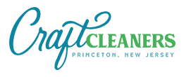 Logo for Craft Cleaners with "Craft" in blue script, "CLEANERS" in green uppercase letters, and "Princeton, New Jersey" below in small blue text.