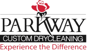 Logo for Parkway Custom Drycleaning with a red rose above the company name and the slogan "Experience the Difference" in red text below.