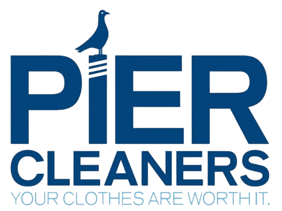 Logo for Pier Cleaners with a bird sitting on the letter "I." Text below reads "YOUR CLOTHES ARE WORTH IT.