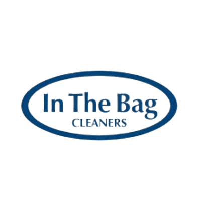 Blue "In The Bag Cleaners" logo with text inside an oval outline on a transparent background.