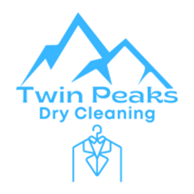 Logo for Twin Peaks Dry Cleaning featuring blue mountain outlines above the business name and a stylized suit on a hanger below.