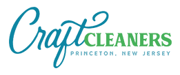 Logo for Craft Cleaners with "Craft" in blue script, "CLEANERS" in green uppercase letters, and "Princeton, New Jersey" below in small blue text.