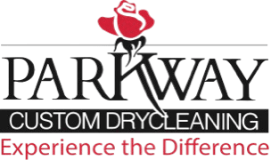 Logo for Parkway Custom Drycleaning with a red rose above the company name and the slogan "Experience the Difference" in red text below.