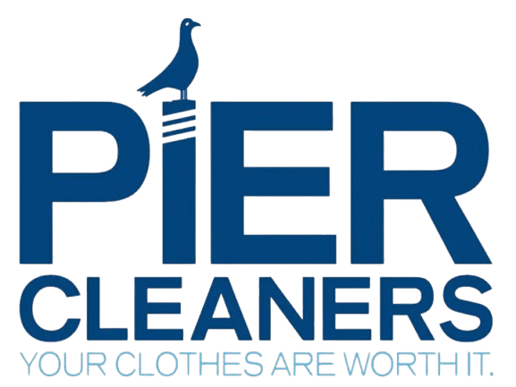 Logo for Pier Cleaners with a bird sitting on the letter "I." Text below reads "YOUR CLOTHES ARE WORTH IT.
