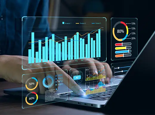 Person using a laptop with digital graphs and charts displaying data analytics, including bar graphs, line charts, and progress circles on the screen.
