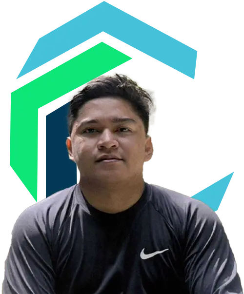 A person in a black Nike shirt sits in front of a background with blue and green geometric shapes.