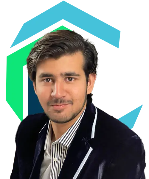 A man with dark hair in a black blazer and striped shirt poses in front of a graphic background with blue and green shapes.