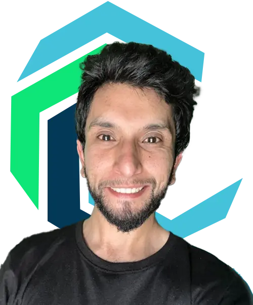 A man with dark hair and a beard smiles at the camera, standing in front of a geometric blue and green logo on a white background.