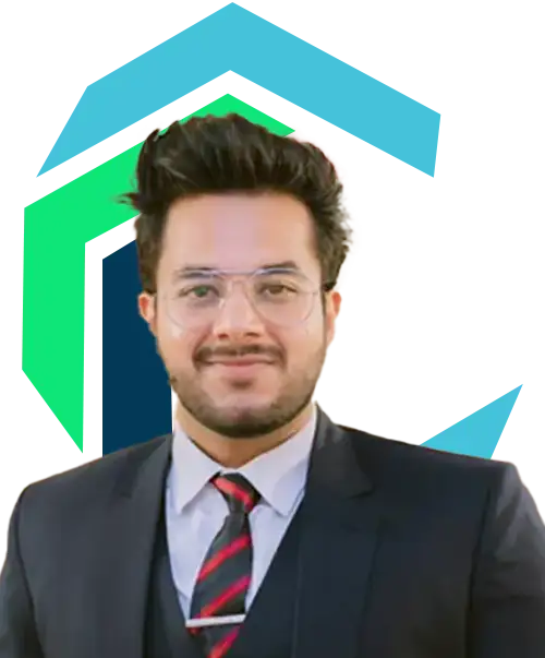 A man wearing glasses and a suit with a red-and-black striped tie stands in front of a multicolored geometric background.
