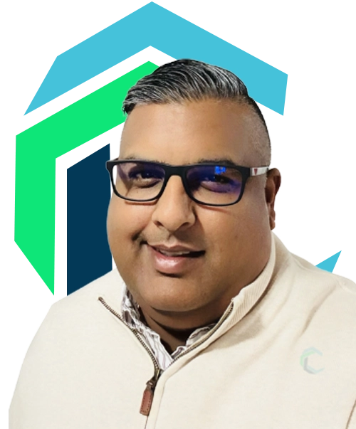 A man with short, styled hair and glasses smiles, wearing a light-colored zip-up sweater, in front of a geometric blue and green background.