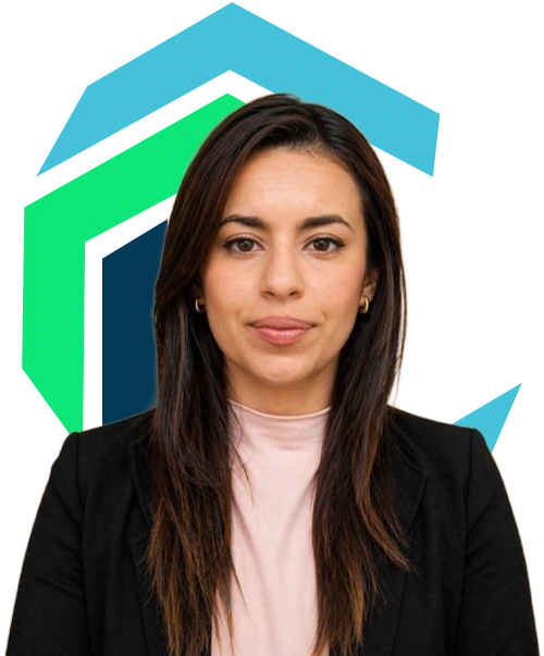 A woman with straight dark hair, wearing a black blazer and light pink top, stands in front of a graphic background with green and blue shapes.